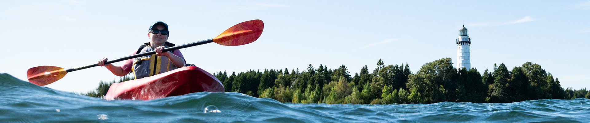 A person kayaking on Lake Michigan.