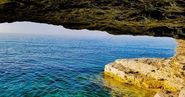 Lake cave entrance looking out to the water