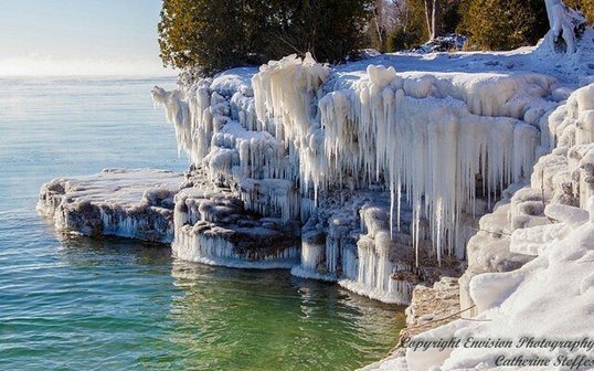 Ice-covered cliffs at the edge of the lake