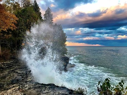 A large way crashing against the shore.