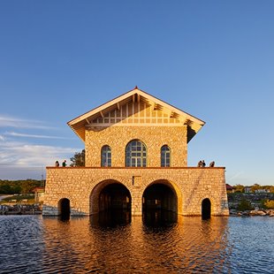 A stone boathouse on the lake.