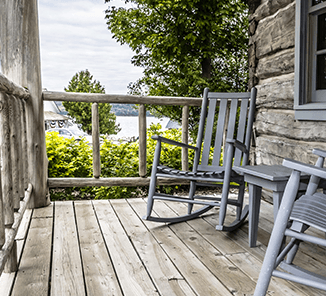 Ephraim Two rocking chairs on a wooden porch.